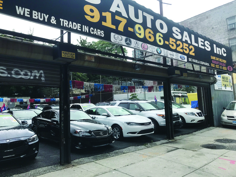NEW YORK: In this file photo used cars are displayed at A Class Auto Sales, a used car dealership in downtown Brooklyn, New York.-AFPnn