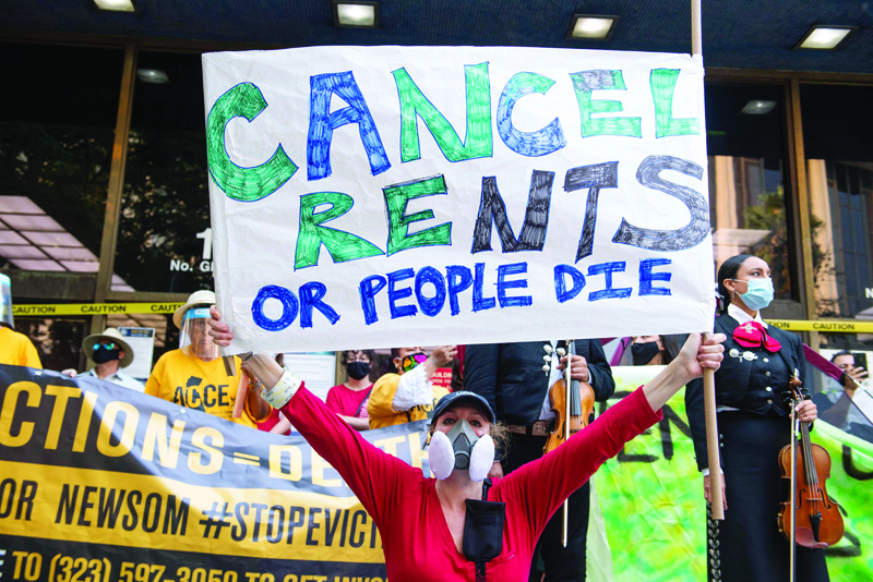 LOS ANGELES: File photo shows renters and housing advocates attend a protest to cancel rent and avoid evictions in front of the court house amid Coronavirus pandemic in Los Angeles, California.  – AFPnn