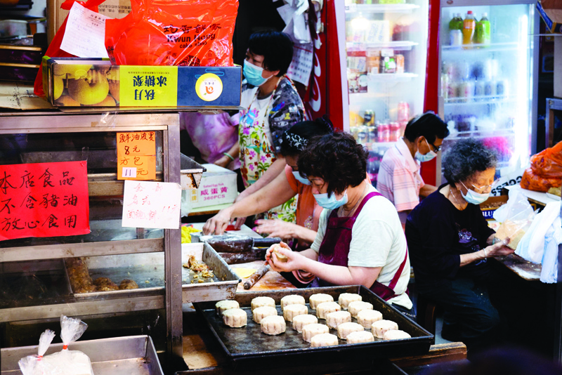 HONG KONG: A worker makes mooncakes at a bakery in Hong Kong. - AFP