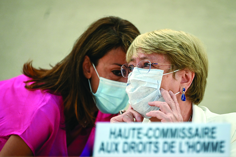 GENEVA: United Nations High Commissioner for Human Rights Michelle Bachelet (right) speaks with an assistant during a special session of the UN Human Rights Council on Afghanistan in Geneva yesterday.-AFPn