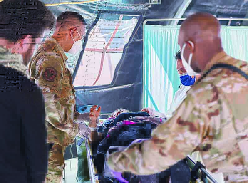 RAMSTEIN, Germany: In this image courtesy of the US Air Force, Airmen assigned to the 86th Medical Group provide post labor care to an Afghan mother who gave birth aboard a US Air Force C-17 Globemaster III.-AFPn