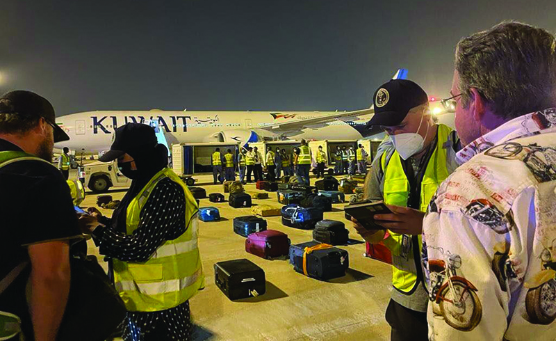 KUWAIT: A handout picture released by the US embassy in Kuwait shows American citizens and Kabul embassy personnel boarding an airplane to the United States at the Kuwait International Airport amid ongoing evacuations from Afghanistan. - AFPn