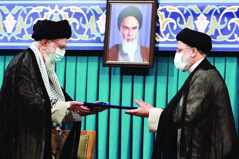 TEHRAN: Iran's Supreme Leader Ayatollah Ali Khamenei inaugurates Ebrahim Raisi as President yesterday. - AFP n