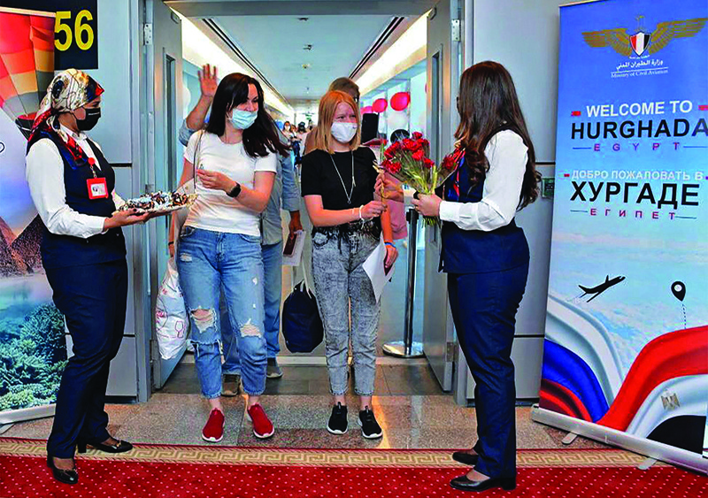 HURGHADA, Egypt: Visitors from Russia arrive in this Red Sea resort yesterday on the first Russian tourist flight since the Oct 2015 bombing of a Russian airliner. - AFP n