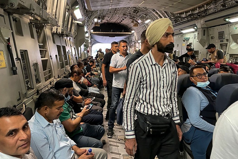 KABUL: Indian nationals sit onboard an Indian military aircraft at the airport on Tuesday to be evacuated from Afghanistan. – AFP n