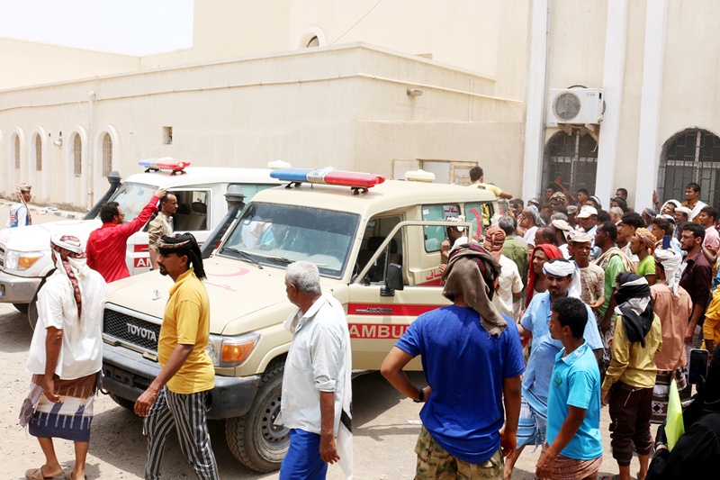 LAHIJ, Yemen: People gather as ambulances transport casualties of strikes on Al-Anad air base to the Ibn Khaldun hospital in the government-held southern province of Lahij, yesterday. - AFPn