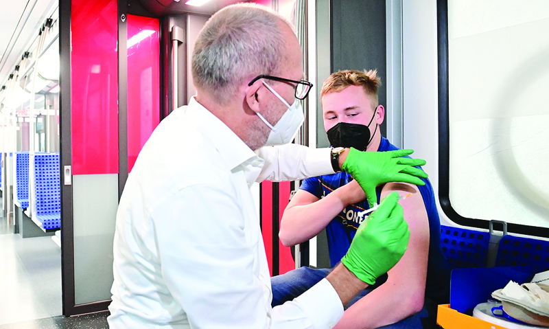 BERLIN: A man receives a Johnson & Johnson Janssen COVID-19 vaccine in a so-called 'Impfzug' (vaccination train) operated by Berliner S-Bahn in Gruenau near Berlin yesterday.-AFPn