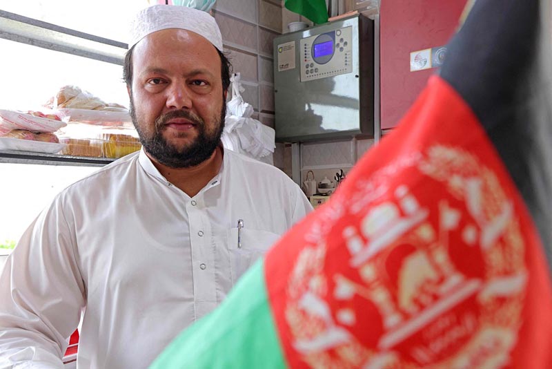 DUBAI: Afghan Aziz Ahmed, the 32-year-old owner of Sabir Afghan restaurant, poses during an interview yesterday. - AFP n