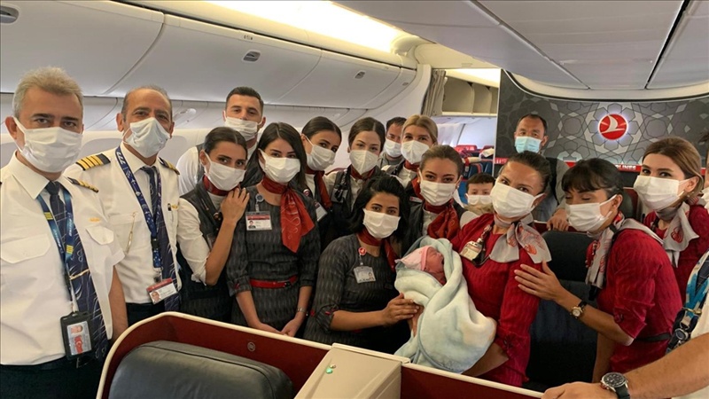 ANKARA: A handout photo released by the Anadolu Agency yesterday shows the cabin crew posing with the baby.n