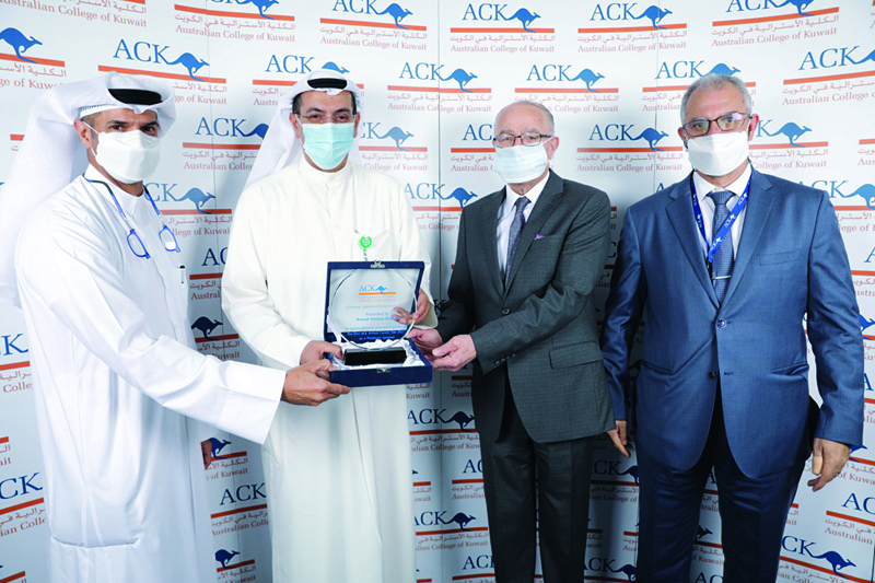 KUWAIT: ACK officials honor KFH officials at the end of the career fair.n
