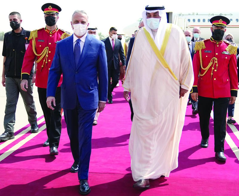 KUWAIT: His Highness the Prime Minister Sheikh Sabah Al-Khaled Al-Hamad Al-Sabah receives his Iraqi counterpart Mustafa Al-Kadhemi upon his arrival to Kuwait yesterday. - KUNAn