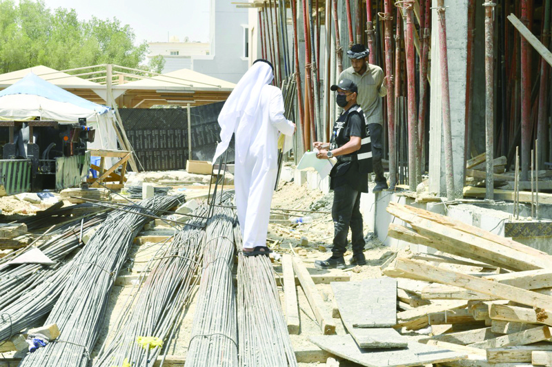 KUWAIT: Inspectors are seen inspecting a construction site in Al-Msasayel yesterday. - KUNA photos