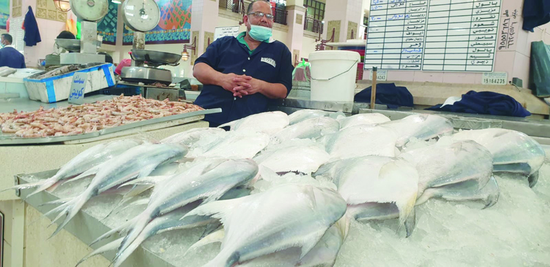 KUWAIT: Several photos showing fish on display at the fish market in Souq Sharq yesterday. - Photos by Ben Garcian