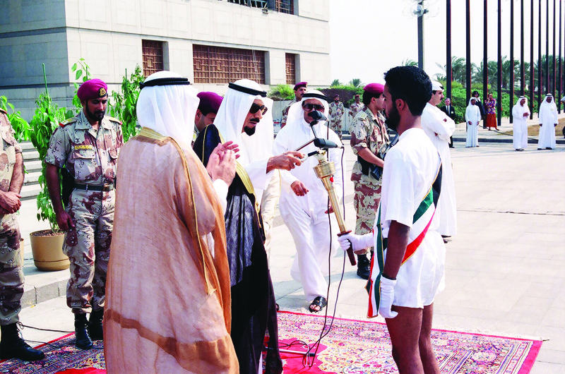 KUWAIT: This archive photo shows the late Amir Sheikh Jaber Al-Ahmad A-Jaber Al-Sabah lighting the 'Torch of Education' during a ceremony to announce the resumption of education after Kuwait was liberated from the Iraqi invasion in 1991. - KUNAn