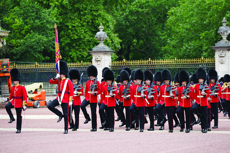 Members of the first Battalion the Coldstream Guards take part in the Changing of the Guard, in the forecourt of Buckingham Palace, which is taking place for the first time since the start of the coronavirus pandemic in London.—AFP photosn