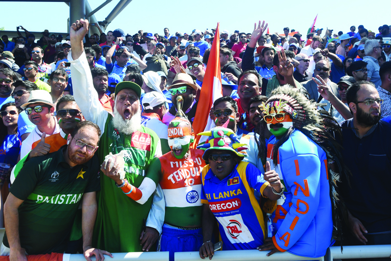 MANCHESTER: In this file photo taken on June 28, 2019 Pakistan (left) and Indian super fans cheer during the 2019 Cricket World Cup group stage match between West Indies and India at Old Trafford in Manchester, northwest England.  - AFPnn