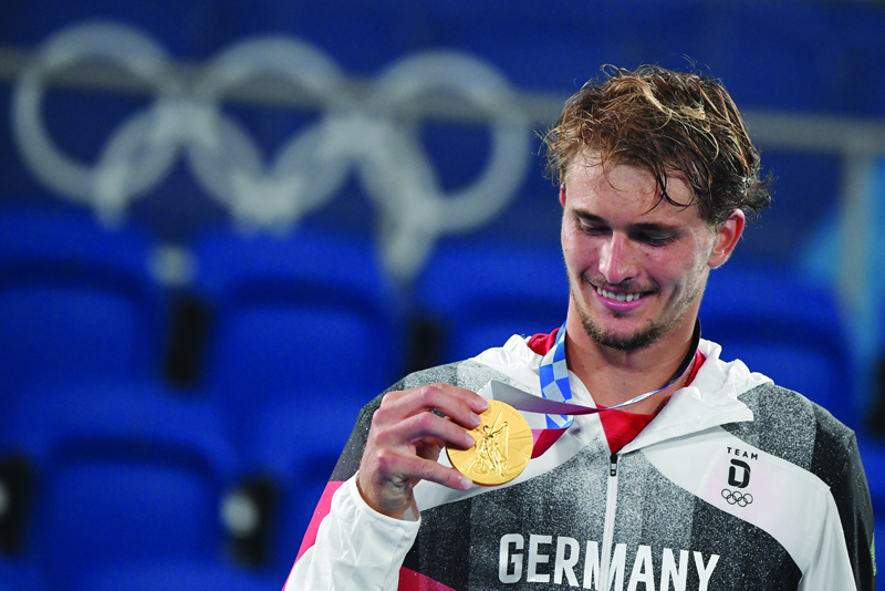 TOKYO: Gold medalist Germany's Alexander Zverev poses with his medal during the Tokyo 2020 Olympic men's singles tennis medal ceremony at the Ariake Tennis Park in Tokyo yesterday. - AFPn