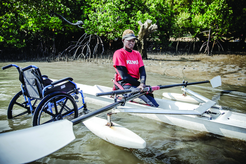 MOMBASA: Kenyan para-rower athlete Asiya Mohammed starts warming up with her boat during her training session at Tudor Water Sports Hotel in Mombasa, Kenya on July 26, 2021 ahead of the preparations for the Tokyo 2020 Paralympic Games. - AFPnn
