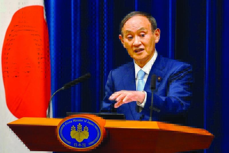 TOKYO: Japan's Prime Minister Yoshihide Suga speaks during a news conference regarding the COVID-19 coronavirus situation in the country from his official residence in Tokyo yesterday. - AFPn