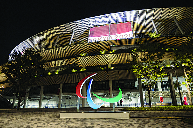 TOKYO: The Paralympics symbol is pictured in front of the National Stadium, the main venue of the games, ahead of the Tokyo 2020 Paralympic Games in Tokyo yesterday. - AFPn