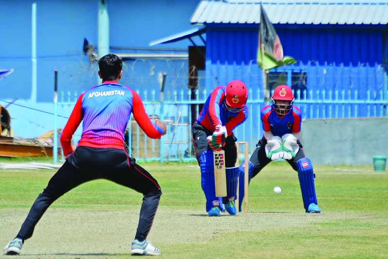 KABUL: Afghanistan's national cricket team players attend a training session at the Kabul International Cricket Ground in Kabul on Saturday, ahead of their one-day series against Pakistan, scheduled to take place in Sri Lanka in two weeks. - AFPn