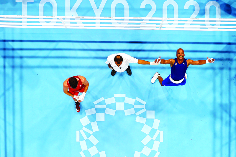 TOKYO: An overview shows Cuba's Roniel Iglesias celebrating after winning against Britain's Pat McCormack after their men's welter (63-69kg) boxing final bout during the Tokyo 2020 Olympic Games at the Kokugikan Arena in Tokyo yesterday. - AFPn