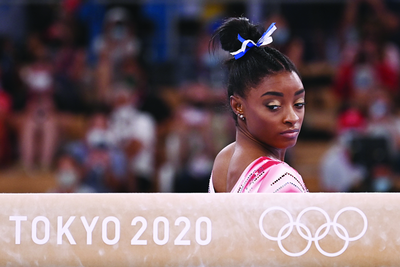 TOKYO: USA's Simone Biles gets ready to compete in the artistic gymnastics women's balance beam final of the Tokyo 2020 Olympic Games at Ariake Gymnastics Centre in Tokyo on Tuesday. - AFPn