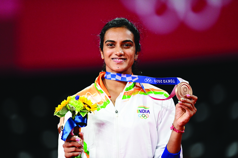 TOKYO: India's P V Sindhu poses with her women's singles badminton bronze medal at a ceremony during the Tokyo 2020 Olympic Games at the Musashino Forest Sports Plaza in Tokyo yesterday. - AFPnn