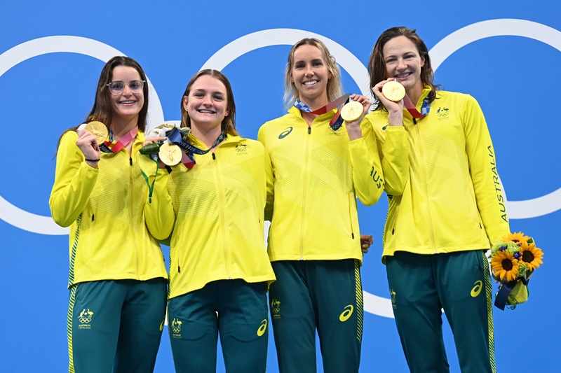 TOKYO: Gold medalists (from left) Australia's Kaylee McKeown, Chelsea Hodges, Emma McKeon and Cate Campbell pose on the podium after the final of the women's 4x100m medley relay swimming event during the Tokyo 2020 Olympic Games at the Tokyo Aquatics Centre in Tokyo on Sunday. – AFPn