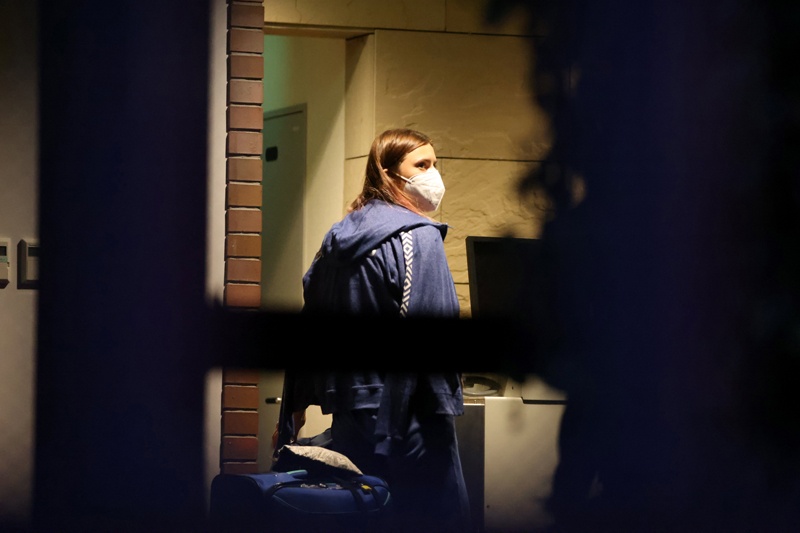 TOKYO: Belarus athlete Krystsina Tsimanouskaya, who claimed her team tried to force her to leave Japan following a row during the Tokyo 2020 Olympic Games, walks with her luggage inside the Polish embassy in Tokyo yesterday. – AFPn