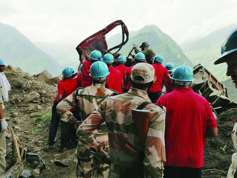 Indo Tibetan Border Police personnel are seen during rescue operations at the site of a landslide at the Reckong Peo-Shimla Highway in Kinnaur District in Himachal Pradesh yesterday. - AFP n