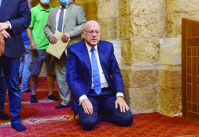 BEIRUT: Prime Minister-designate Najib Mikati attends prayers at the Al-Omari mosque in the Lebanese capital Beirut, ahead of meeting with the Lebanese President. — AFP