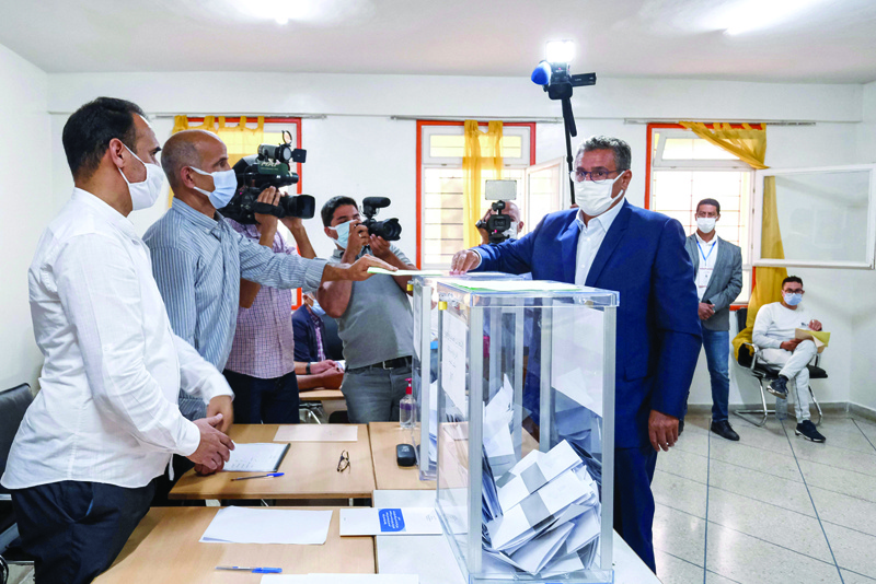 SALE, Morocco: Aziz Akhannouch, president of the National Rally of Independents (RNI), casts his ballot in Sale yesterday as Moroccans vote in parliamentary and local elections. -  AFP n