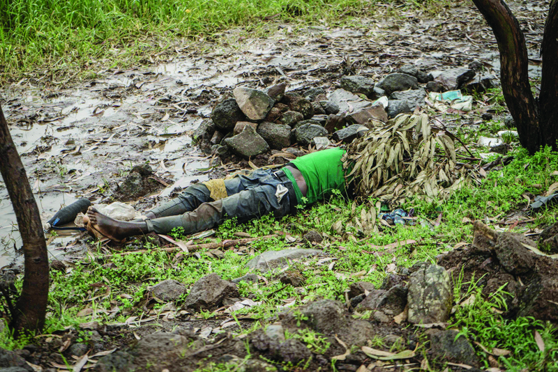 CHENNA: An unidentified corpse is seen on the ground near the village of Chenna, 95 kilometers northeast of the city of Gondar, Ethiopia. - AFP n