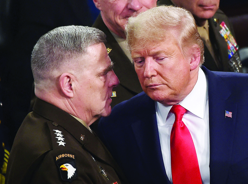 WASHINGTON: In this file photo, Chairman of the Joint Chiefs of Staff, Army General Mark Milley (left) chats with US President Donald Trump after he delivered the State of the Union address at the US Capitol in Washington, DC. - AFP n