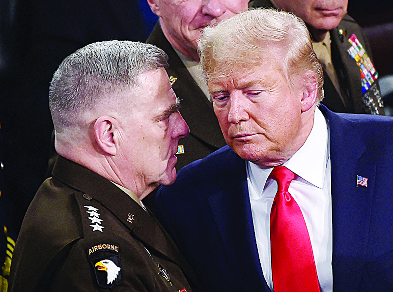 WASHINGTON: In this file photo taken on February 04, 2020, Chairman of the Joint Chiefs of Staff, Army General Mark Milley (left) chats with US President Donald Trump after he delivered the State of the Union address at the US Capitol in Washington, DC. - AFPn