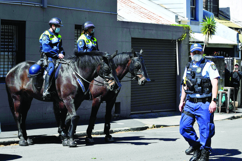 SYDNEY: Mounted police patrol near the Construction, Forestry, Mining and Energy Union (CFMEU) headquarters in Sydney amid a demonstration call by 0construction workers against COVID-19 restrictions. - AFP n