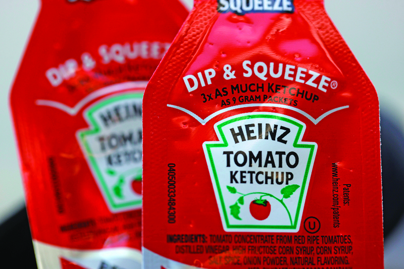NOVATO, US: Packets of Heinz ketchup are displayed in Novato, California. US regulators fined Kraft Heinz $62 million over an alleged accounting scheme.-AFPn