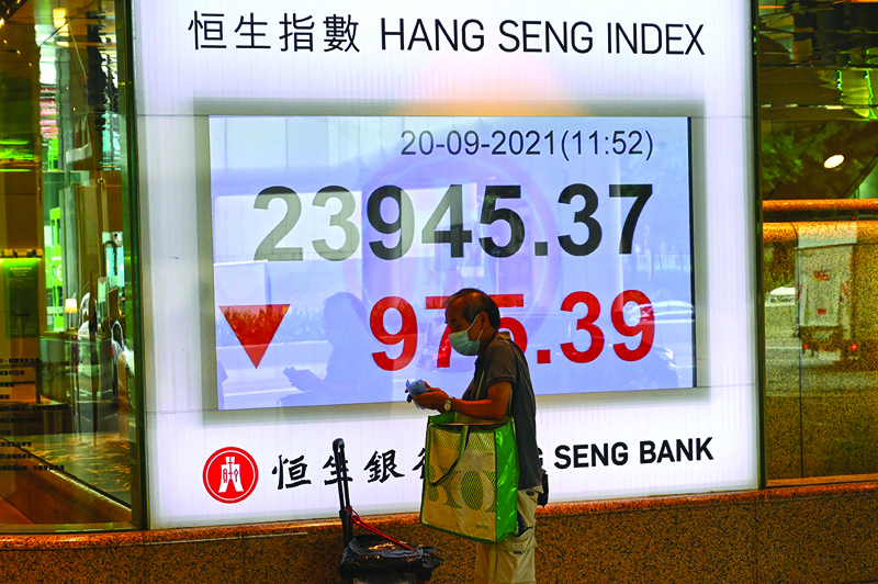 HONG KONG, China: An electronic board shows the Hang Seng index after it tumbled more than four percent in the morning session, in Hong Kong yesterday. - AFPnnn