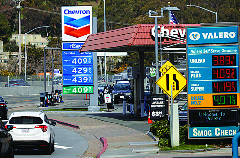 MILL VALLEY, US: In this file photo, gas prices are displayed at a Chevron gas station in Mill Valley, California. - AFPn