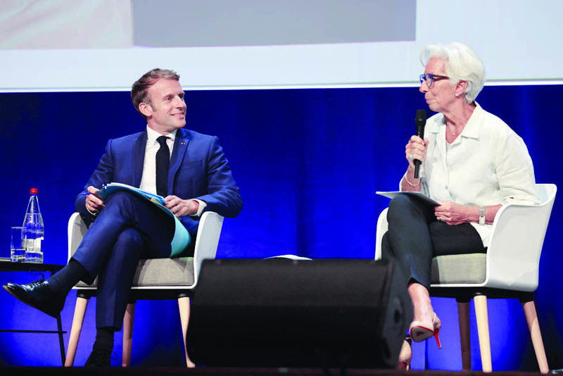 MARSEILLE, France: French President Emmanuel Macron (left) listens to ECB chief Christine Lagarde during the IUCN World Conservation Congress in Marseille.-AFPn
