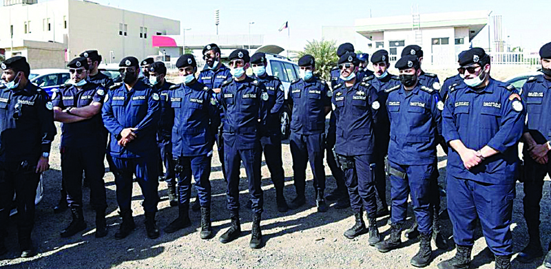 KUWAIT: This handout photo released by the Interior Ministry yesterday shows police officers at the site of a crackdown in Fahaheel Industrial Area.n