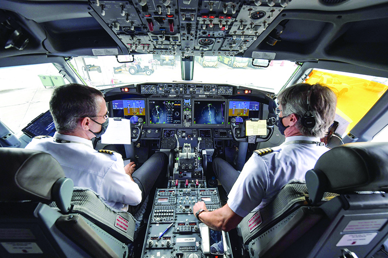 SAO PAULO: Photo shows pilots in the cockpit of a Boeing 737 MAX aircraft operated by low-cost airline Gol before take off at Guarulhos International Airport. The security measures put in place in airports and airplanes after the September 11 attacks have drastically limited the risk of a terrorist breaking into the cockpit. — AFP