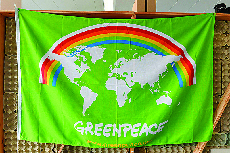 AMSTERDAM: A picture shows a flag at the headquarters of the NGO Greenpeace on Sept 10, 2021 ahead of the 50th anniversary of the group's founding. - AFP  n