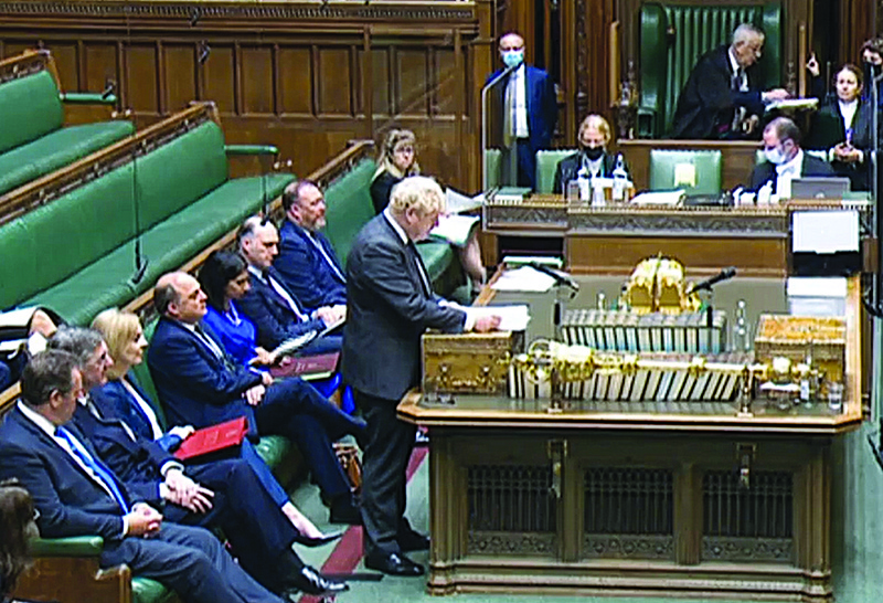 LONDON: A video grab from footage broadcast by the UK Parliament's Parliamentary Recording Unit (PRU) shows Britain's Prime Minister Boris Johnson giving a statement on new defense pact in the House of Commons in London yesterday.-AFPn