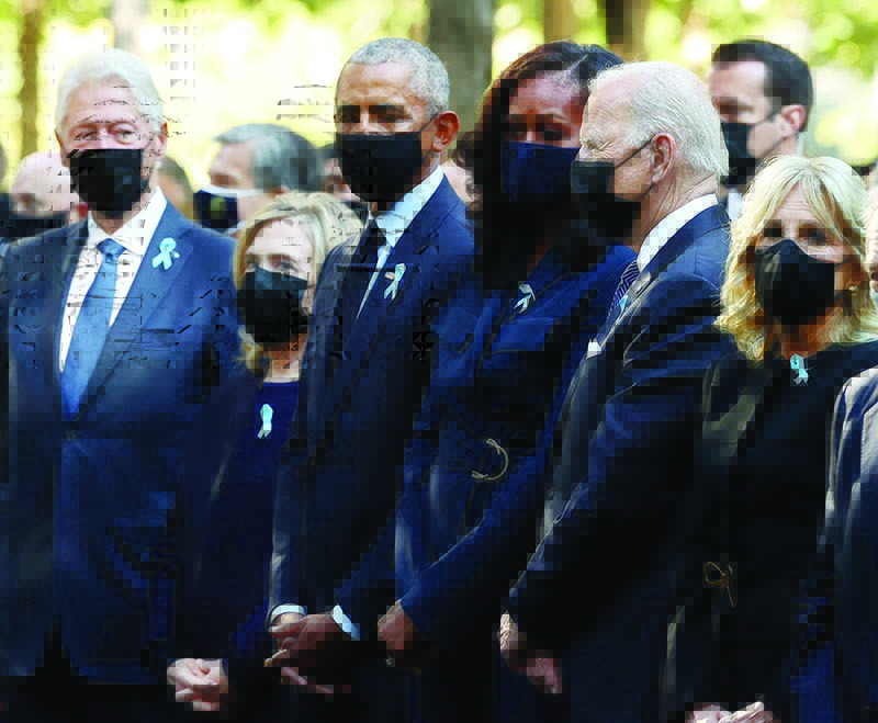 NEW YORK: (From left) Former US President Bill Clinton, former First Lady Hillary Clinton, former President Barack Obama, former First Lady Michelle Obama, President Joe Biden and First Lady Jill Biden attend the annual 9/11 commemoration ceremony at the National 9/11 Memorial and Museum yesterday. — AFP