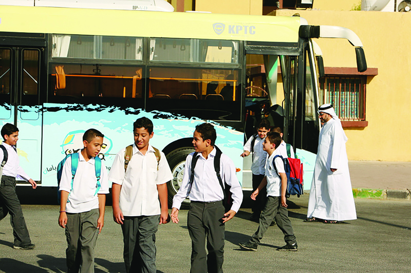 KUWAIT: Students alight from a school bus in this pre-pandemic file photo. Photo used for illustrative purposes only. n