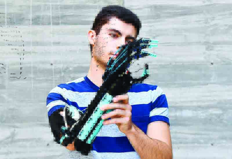 SANT CUGAT DEL VALLES, Spain: 2017 Guinness World record holder and 2020 Lego Masters France winner, Andorran university student David Aguilar, 22, affected by Poland syndrome, poses with his self-built prosthetic arm made with Lego pieces near Barcelona on Sept 9, 2021. – AFP n