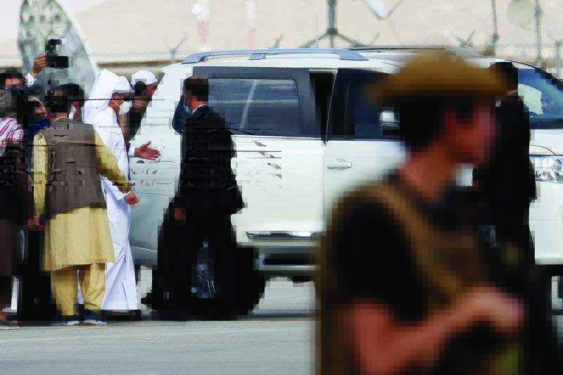 KABUL: Qatari Deputy Prime Minister and Foreign Minister Mohammed bin Abdulrahman Al-Thani boards a car upon arrival at the airport yesterday. - AFP n