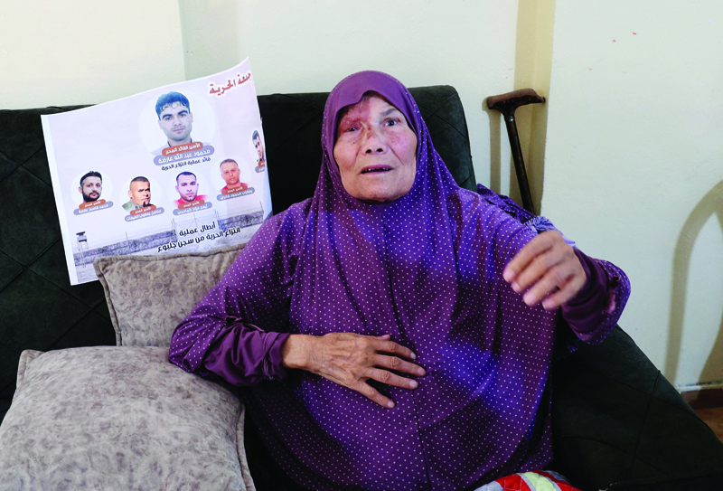 ARABAH: Fathiya Al-Ardah, mother of escaped Palestinian prisoner Mahmud Al-Ardah, speaks at their home in this village near Jenin on Sept 12, 2021 after her son's arrest by Zionist authorities. – AFP n